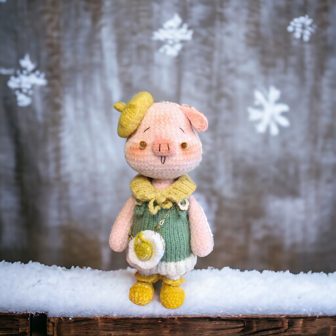 Crochet pig named Petunia, designed with a soft pink hue and a playful dress, radiating warmth and pleasantness.